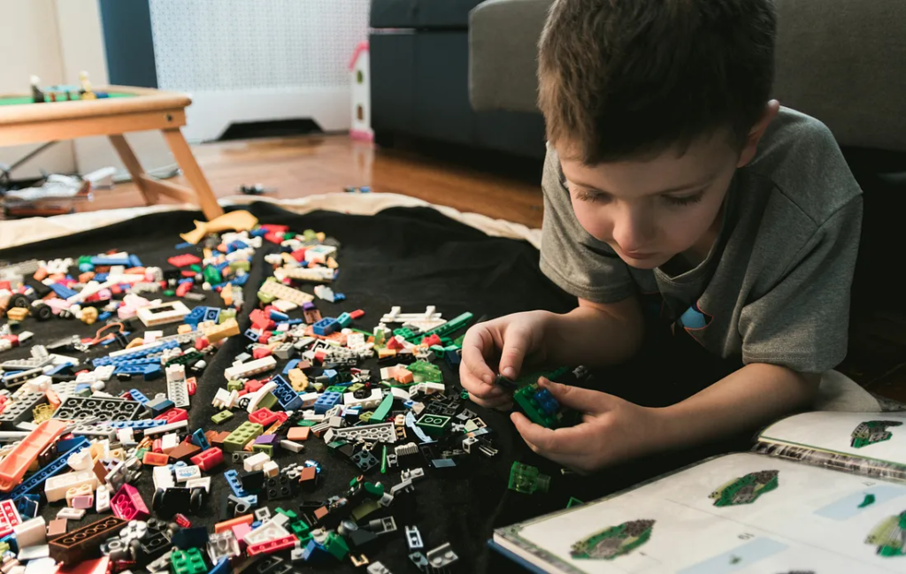 kid playing with LEGO